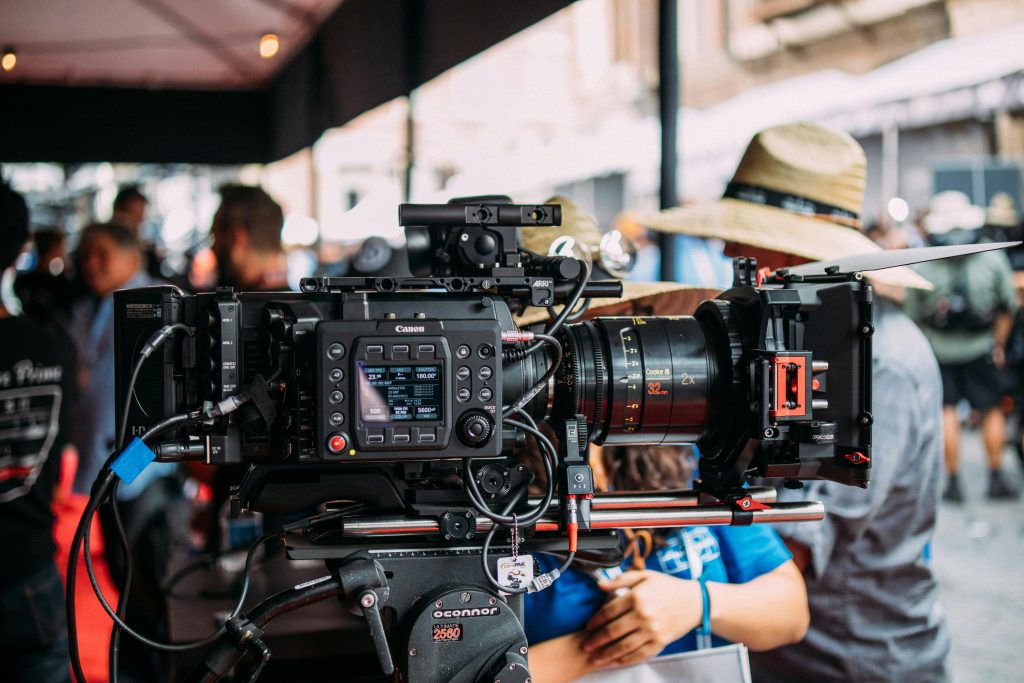 pexels photo 2443272 2443272 Close-up of a professional video camera setup at an outdoor event focusing on filmmaking equipment.